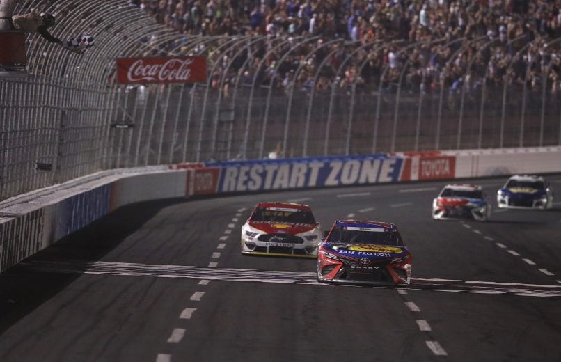 CHARLOTTE, NORTH CAROLINA - MAY 26: Martin Truex Jr., driver of the #19 Bass Pro Shops/TRACKER/USO Toyota, crosses the finish line on his way to winning the Monster Energy NASCAR Cup Series Coca-Cola 600 at Charlotte Motor Speedway on May 26, 2019 in Charlotte, North Carolina. (Photo by Streeter Lecka/Getty Images) | Getty Images
