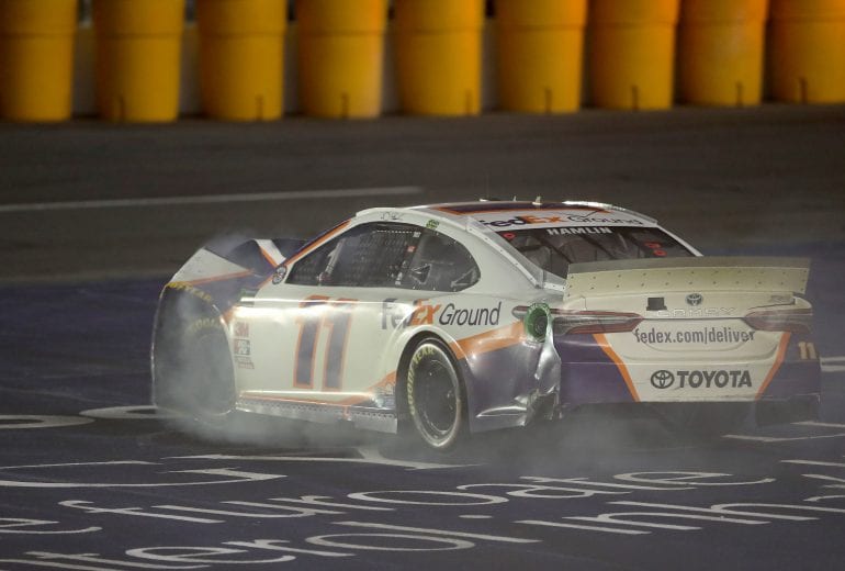 CHARLOTTE, NORTH CAROLINA - MAY 26: Denny Hamlin, driver of the #11 FedEx Ground Toyota, drives his car to pit road during the Monster Energy NASCAR Cup Series Coca-Cola 600 at Charlotte Motor Speedway on May 26, 2019 in Charlotte, North Carolina. (Photo by Streeter Lecka/Getty Images) | Getty Images
