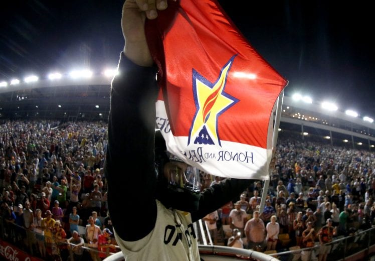 CHARLOTTE, NORTH CAROLINA - MAY 26: A NASCAR Official holds a flagd after the Monster Energy NASCAR Cup Series Coca-Cola 600 at Charlotte Motor Speedway on May 26, 2019 in Charlotte, North Carolina. (Photo by Brian Lawdermilk/Getty Images) | Getty Images