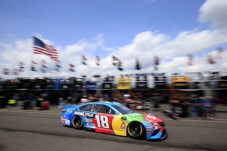 LONG POND, PENNSYLVANIA - MAY 31: Kyle Busch drives the #18 M&M's Hazelnut Toyota through the garage area during practice for the Monster Energy NASCAR Cup Series Pocono 400 at Pocono Raceway on May 31, 2019 in Long Pond, Pennsylvania. (Photo by Chris Trotman/Getty Images) | Getty Images