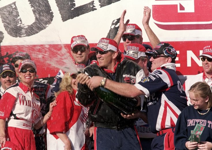 20 Feb 2000: Dale Jarrett sprays the croud with champagne after the Daytona 500, part of the NASCAR Busch Series at the Daytona International Speedway in Daytona Beach, Florida.