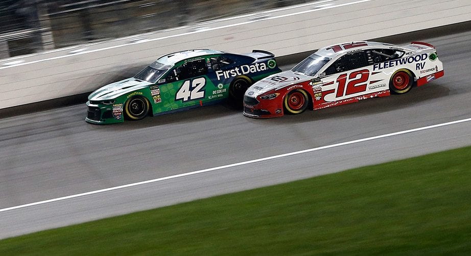 KANSAS CITY, KS - MAY 12:  Kyle Larson, driver of the #42 Clover/First Data Chevrolet, leads Ryan Blaney, driver of the #12 REV Group Ford, during the Monster Energy NASCAR Cup Series KC Masterpiece 400 at Kansas Speedway on May 12, 2018 in Kansas City, Kansas.  (Photo by Brian Lawdermilk/Getty Images) | Getty Images