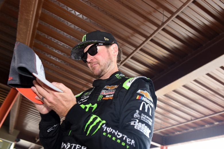 BROOKLYN, MICHIGAN - JUNE 08: Kurt Busch, driver of the #1 Monster Energy Chevrolet, signs autographs on his way to the car during qualifying for the Monster Energy NASCAR Cup Series FireKeepers Casino 400 at Michigan International Speedway on June 08, 2019 in Brooklyn, Michigan. (Photo by Logan Riely/Getty Images) | Getty Images