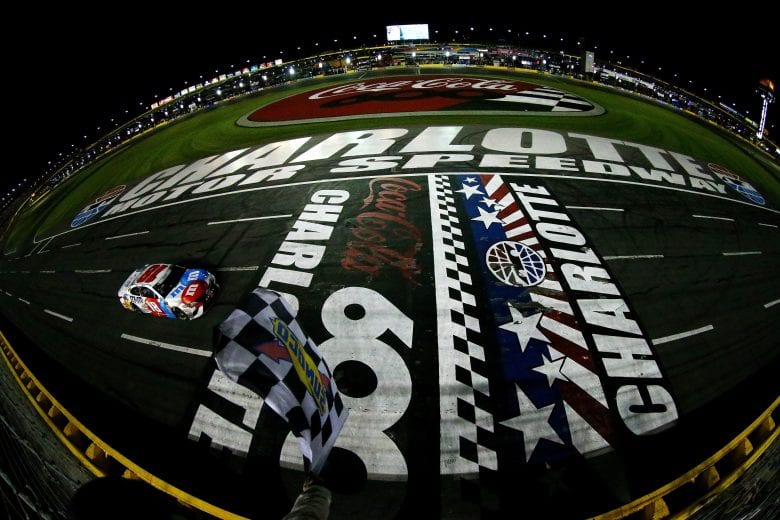 CHARLOTTE, NC - MAY 27: Kyle Busch, driver of the #18 M&M's Red White & Blue Toyota, takes the checkered flag to win the Monster Energy NASCAR Cup Series Coca-Cola 600 at Charlotte Motor Speedway on May 27, 2018 in Charlotte, North Carolina. (Photo by Sarah Crabill/Getty Images) | Getty Images