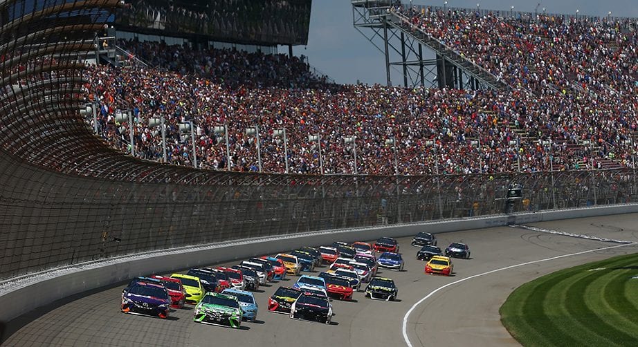 BROOKLYN, MI - AUGUST 12:  Denny Hamlin, driver of the #11 FedEx Office Toyota, and Kyle Busch, driver of the #18 Interstate Batteries Toyota, take the green flag to start the Monster Energy NASCAR Cup Series Consmers Energy 400 at Michigan International Speedway on August 12, 2018 in Brooklyn, Michigan.  (Photo by Sarah Crabill/Getty Images) | Getty Images