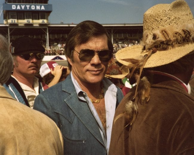 DAYTONA BEACH, FL: Film director and stuntman Hal Needham enjoys pre-race activities before a NASCAR race at Daytona International Speedway. Needham was a successful car owner on the NASCAR Cup circuit from 1981 through 1989, with his cars making 250 Cup starts. Driver Harry Gant won nine Cup races during the period for the Burt Reynolds-Hal Needham Skoal Bandit team. Stan Barrett, Rick Mast and Morgan Shepherd also drove for Needham. (Photo by ISC Images & Archives via Getty Images)