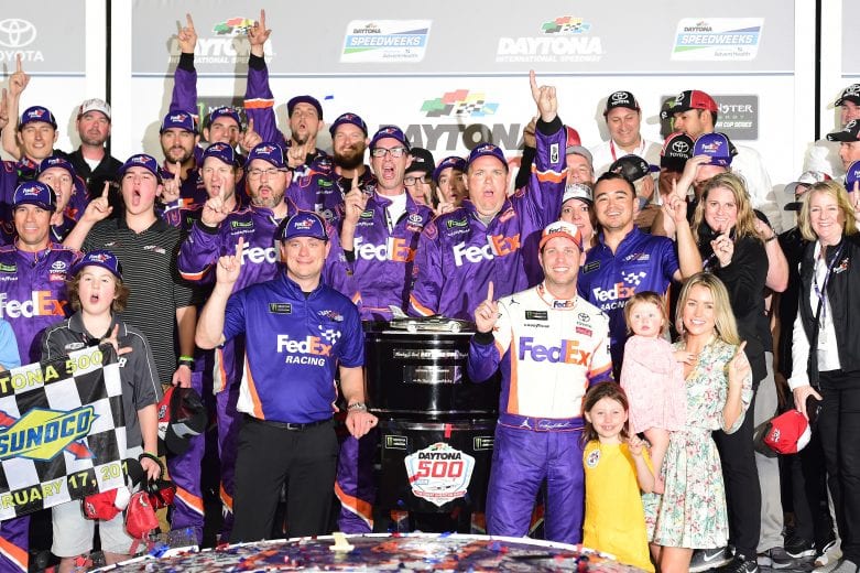DAYTONA BEACH, FL - FEBRUARY 17:  Denny Hamlin, driver of the #11 FedEx Express Toyota, celebrates in victory lane after winning the Monster Energy NASCAR Cup Series 61st Annual Daytona 500 at Daytona International Speedway on February 17, 2019 in Daytona Beach, Florida.  (Photo by Jared C. Tilton/Getty Images) | Getty Images