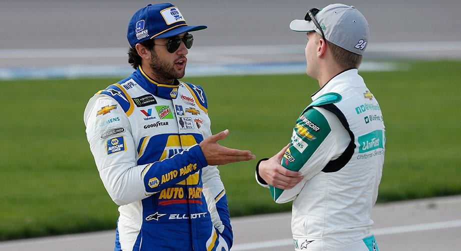 KANSAS CITY, KS - MAY 10: Chase Elliott, driver of the #9 NAPA Auto Parts Chevrolet, talks with, William Byron, driver of the #24 UniFirst Chevrolet, during qualifying for the Monster Energy NASCAR Cup Series Digital Ally 400 at Kansas Speedway on May 10, 2019 in Kansas City, Kansas. (Photo by Brian Lawdermilk/Getty Images) | Getty Images