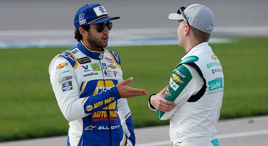 KANSAS CITY, KS - MAY 10: Chase Elliott, driver of the #9 NAPA Auto Parts Chevrolet, talks with, William Byron, driver of the #24 UniFirst Chevrolet, during qualifying for the Monster Energy NASCAR Cup Series Digital Ally 400 at Kansas Speedway on May 10, 2019 in Kansas City, Kansas. (Photo by Brian Lawdermilk/Getty Images) | Getty Images