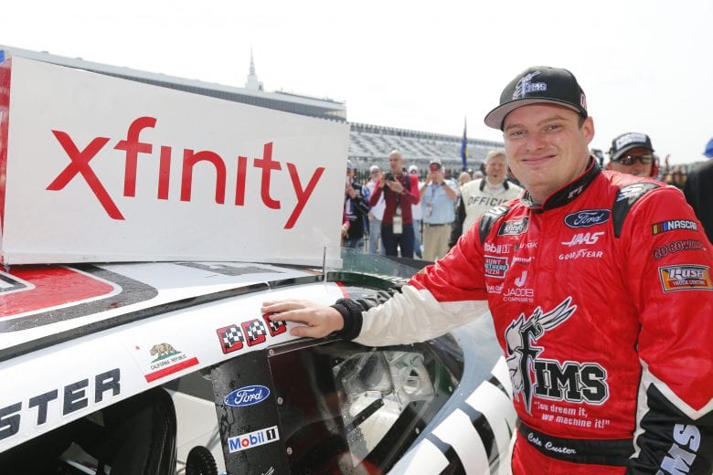 LONG POND, PENNSYLVANIA - JUNE 01: Cole Custer, driver of the #00 FIMS Manufacturing Ford, poses with the winner's decal on his car in Victory Lane after winning the NASCAR Xfinity Series Pocono Green 250 at Pocono Raceway on June 01, 2019 in Long Pond, Pennsylvania. (Photo by Jonathan Ferrey/Getty Images) | Getty Images