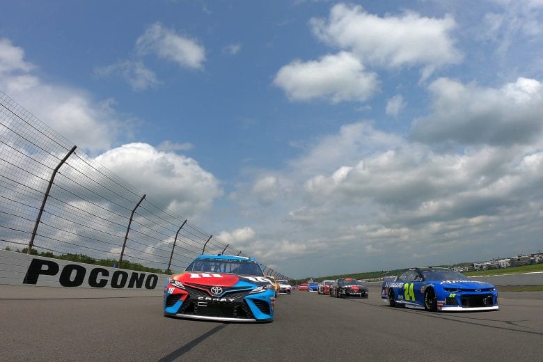 LONG POND, PENNSYLVANIA - JUNE 02: William Byron, driver of the #24 Hendrick Autoguard Chevrolet, and Kyle Busch, driver of the #18 M&M's Hazelnut Toyota, lead the field prior to the start of the Monster Energy NASCAR Cup Series Pocono 400 at Pocono Raceway on June 02, 2019 in Long Pond, Pennsylvania. (Photo by Jared C. Tilton/Getty Images) | Getty Images