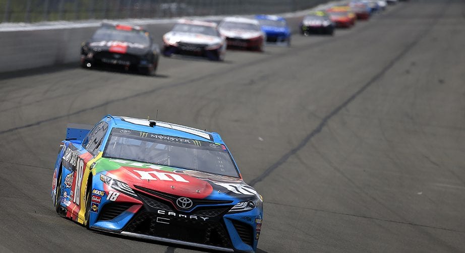 LONG POND, PENNSYLVANIA - JUNE 02: Kyle Busch, driver of the #18 M&M's Hazelnut Toyota, leads a pack of cars during the Monster Energy NASCAR Cup Series Pocono 400 at Pocono Raceway on June 02, 2019 in Long Pond, Pennsylvania. (Photo by Chris Trotman/Getty Images) | Getty Images