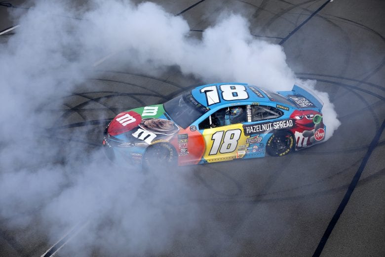 LONG POND, PENNSYLVANIA - JUNE 02: Kyle Busch, driver of the #18 M&M's Hazelnut Toyota, celebrates with a burnout after winning the Monster Energy NASCAR Cup Series Pocono 400 at Pocono Raceway on June 02, 2019 in Long Pond, Pennsylvania. (Photo by Jonathan Ferrey/Getty Images) | Getty Images