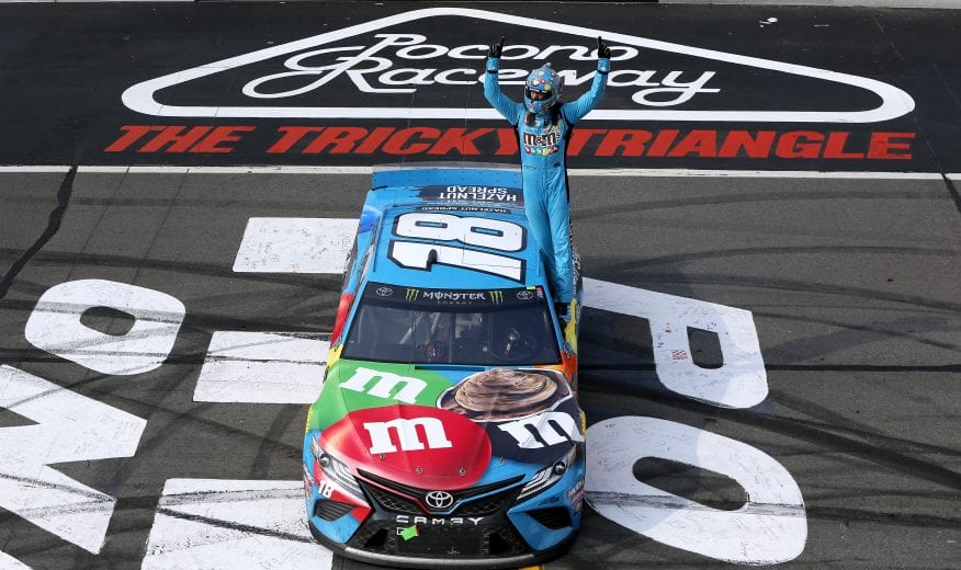 LONG POND, PENNSYLVANIA - JUNE 02: Kyle Busch, driver of the #18 M&M's Hazelnut Toyota, celebrates winning the Monster Energy NASCAR Cup Series Pocono 400 at Pocono Raceway on June 02, 2019 in Long Pond, Pennsylvania. (Photo by Jonathan Ferrey/Getty Images) | Getty Images