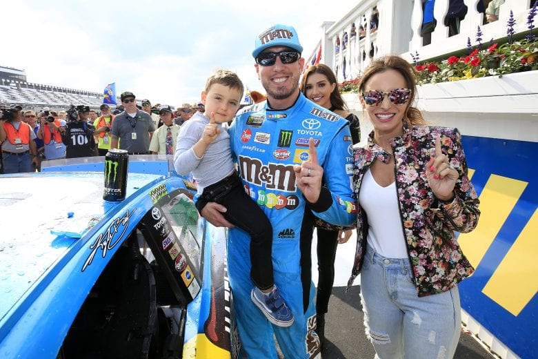 LONG POND, PENNSYLVANIA - JUNE 02: Kyle Busch, driver of the #18 M&M's Hazelnut Toyota, celebrates with his wife, Samantha, and their son, Brexton, in Victory Lane after winning the Monster Energy NASCAR Cup Series Pocono 400 at Pocono Raceway on June 02, 2019 in Long Pond, Pennsylvania. (Photo by Chris Trotman/Getty Images) | Getty Images