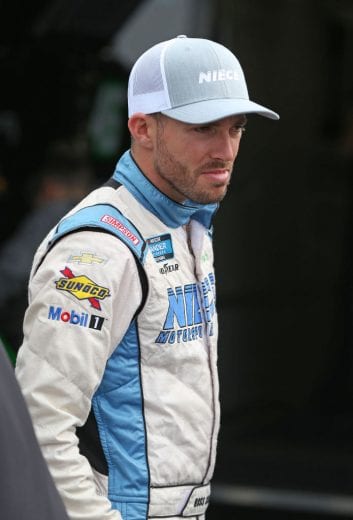 NEWTON, IOWA - JUNE 15: Ross Chastain, driver of the #44 TruNorth/Paul Jr Designs Chevrolet, stands in the garage area during practice for the NASCAR Gander Outdoor Truck Series M&M'S 200 at Iowa Speedway on June 15, 2019 in Newton, Iowa. (Photo by Matt Sullivan/Getty Images) | Getty Images
