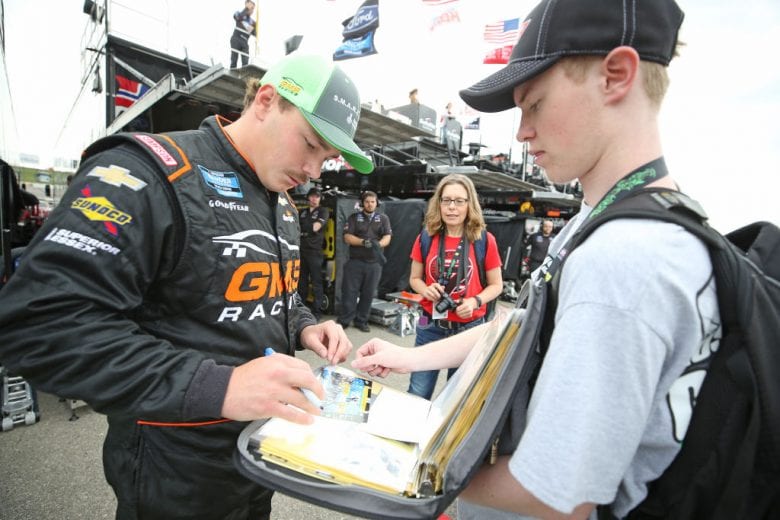 NEWTON, IOWA - JUNE 15: Brett Moffitt, driver of the #24 Destiny Homes Smart Series Chevrolet, signs autographs during practice for the NASCAR Gander Outdoor Truck Series M&M'S 200 at Iowa Speedway on June 15, 2019 in Newton, Iowa. (Photo by Matt Sullivan/Getty Images) | Getty Images