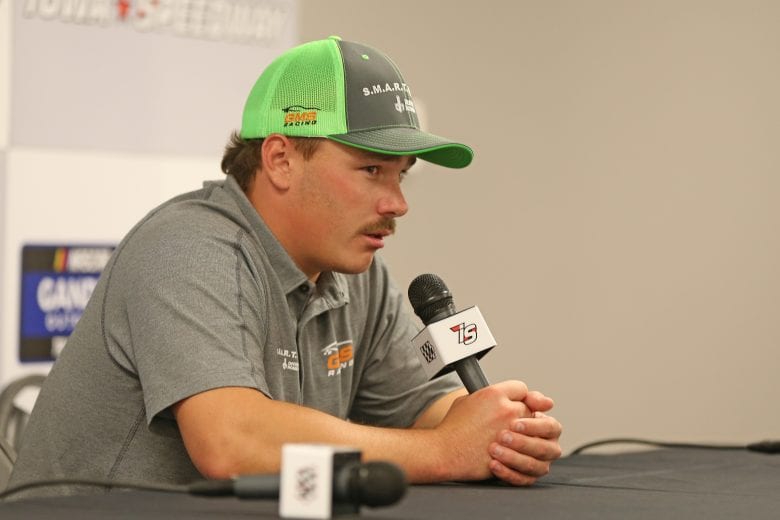 NEWTON, IOWA - JUNE 16: Brett Moffitt, driver of the #24 Destiny Homes Smart Series Chevrolet, speaks during a press conference after being declared the winner of the NASCAR Gander Outdoor Truck Series M&M's 200 Presented by Casey's General Store at Iowa Speedway on June 16, 2019 in Newton, Iowa. Ross Chastain, driver of the #44 TruNorth/Paul Jr Designs Chevrolet, was disqualified after a rules violation. (Photo by Matt Sullivan/Getty Images) | Getty Images