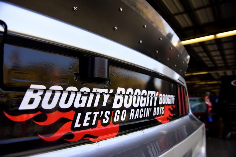 A detailed view of the Darrell Waltrip tribute on David Ragan's No. 38 Ford in the Sonoma Raceway garage.