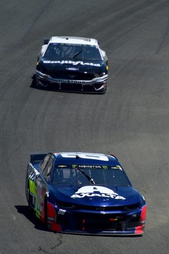 SONOMA, CALIFORNIA - JUNE 23: Alex Bowman, driver of the #88 Axalta Chevrolet, leads Aric Almirola, driver of the #10 Smithfield Ford, during the Monster Energy NASCAR Cup Series Toyota/Save Mart 350 at Sonoma Raceway on June 23, 2019 in Sonoma, California. (Photo by Jared C. Tilton/Getty Images) | Getty Images