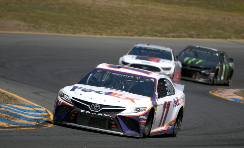 SONOMA, CALIFORNIA - JUNE 23: Denny Hamlin, driver of the #11 FedEx Ground Toyota, leads a pack during the Monster Energy NASCAR Cup Series Toyota/Save Mart 350 at Sonoma Raceway on June 23, 2019 in Sonoma, California. (Photo by Robert Reiners/Getty Images) | Getty Images