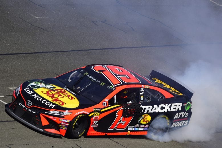 SONOMA, CALIFORNIA - JUNE 23: Martin Truex Jr., driver of the #19 Bass Pro Shops Toyota, celebrates with a burnout after winning the Monster Energy NASCAR Cup Series Toyota/Save Mart 350 at Sonoma Raceway on June 23, 2019 in Sonoma, California. (Photo by Jared C. Tilton/Getty Images) | Getty Images