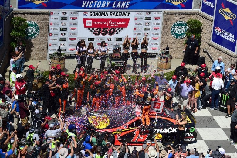 SONOMA, CALIFORNIA - JUNE 23: Martin Truex Jr., driver of the #19 Bass Pro Shops Toyota, celebrates in Victory Lane after winning the Monster Energy NASCAR Cup Series Toyota/Save Mart 350 at Sonoma Raceway on June 23, 2019 in Sonoma, California. (Photo by Jared C. Tilton/Getty Images) | Getty Images