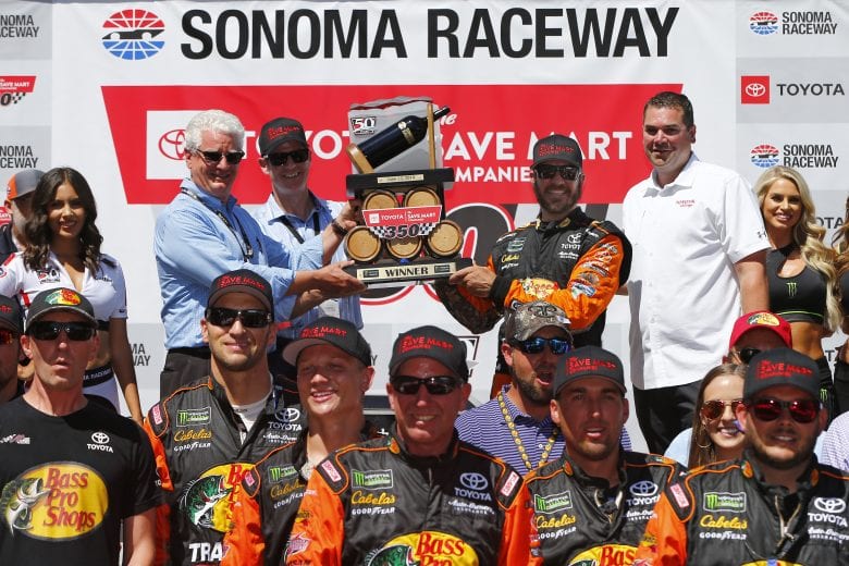 SONOMA, CALIFORNIA - JUNE 23: Martin Truex Jr., driver of the #19 Bass Pro Shops Toyota, celebrates in Victory Lane after winning the Monster Energy NASCAR Cup Series Toyota/Save Mart 350 at Sonoma Raceway on June 23, 2019 in Sonoma, California. (Photo by Jonathan Ferrey/Getty Images) | Getty Images