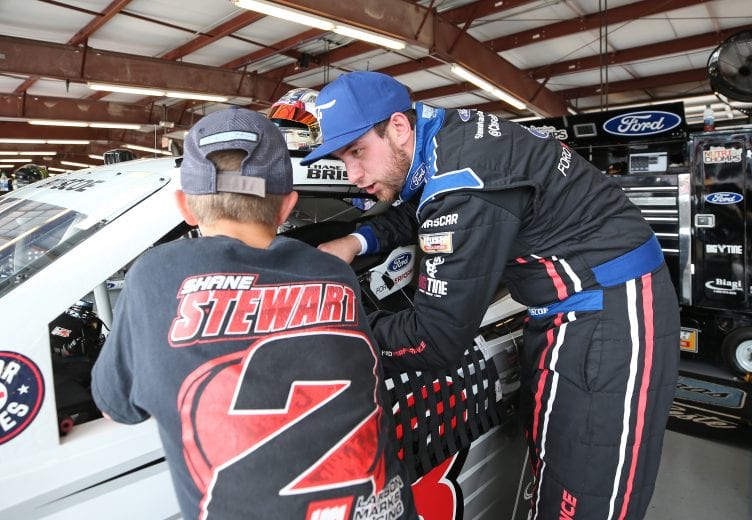 JOLIET, ILLINOIS - JUNE 28: Chase Briscoe, driver of the #98 Ford Performance Ford, talks with a fan during practice for the NASCAR Xfinity Series Camping World 300 at Chicagoland Speedway on June 28, 2019 in Joliet, Illinois. (Photo by Matt Sullivan/Getty Images) | Getty Images