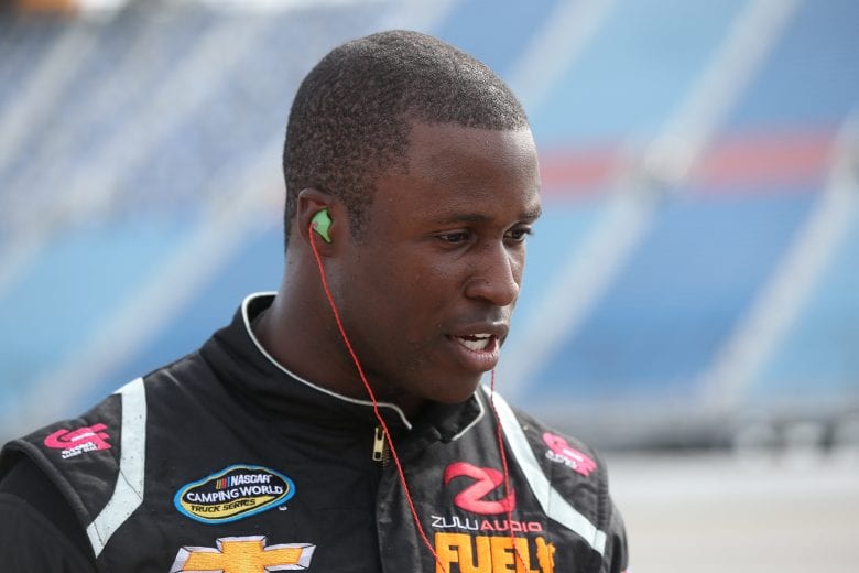 JOLIET, ILLINOIS - JUNE 28: Jesse Iwuji, driver of the #34 Chevrolet, stands by his truck during qualifying for the NASCAR Gander Outdoors Truck Series Camping World 225 at Chicagoland Speedway on June 28, 2019 in Joliet, Illinois. (Photo by Matt Sullivan/Getty Images) | Getty Images