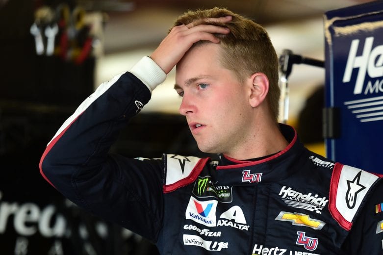 JOLIET, ILLINOIS - JUNE 29: William Byron, driver of the #24 Liberty University Chevrolet, stands in the garage area during practice for the Monster Energy NASCAR Cup Series Camping World 400 at Chicagoland Speedway on June 29, 2019 in Joliet, Illinois. (Photo by Jared C. Tilton/Getty Images) | Getty Images