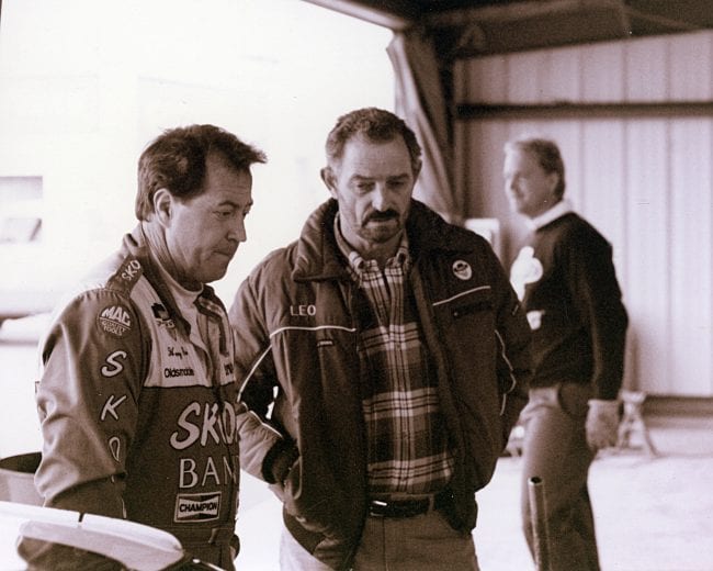 RICHMOND, VA — Early-1990s: Driver Harry Gant (L) and car owner Leo Jackson (R) talk in the garage area at Richmond International Raceway prior to a NASCAR Cup race. Jackson owned the Skoal Bandit cars Gant drove on the Cup circuit from 1989 through 1994. (Photo by ISC Images & Archives via Getty Images)