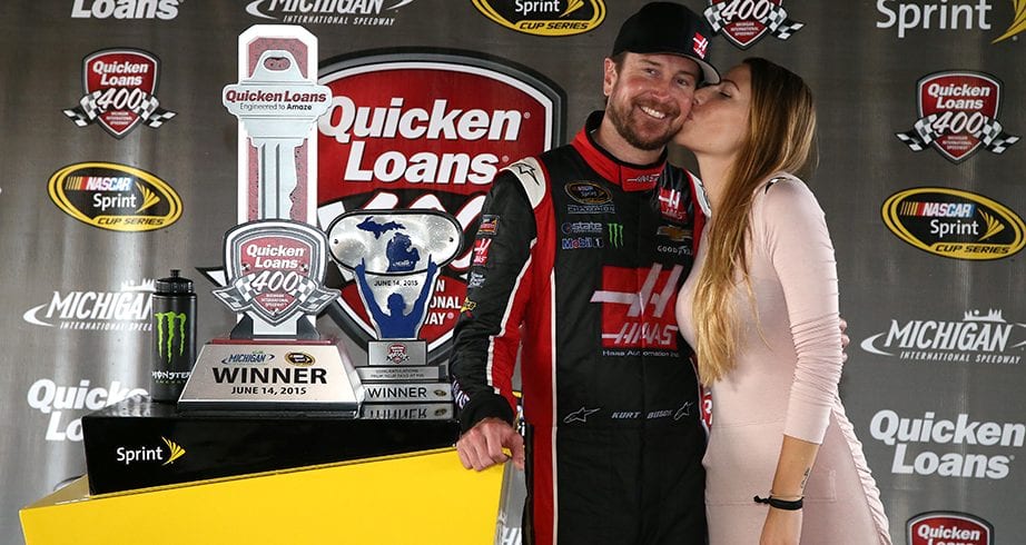 BROOKLYN, MI - JUNE 14:  Kurt Busch, driver of the #41 Haas Automation Chevrolet, and his girlfriend Ashley Van Metre celebrate in an alternate Victory Lane after winning the NASCAR Sprint Cup Series Quicken Loans 400 at Michigan International Speedway on June 14, 2015 in Brooklyn, Michigan.  (Photo by Sean Gardner/NASCAR via Getty Images)