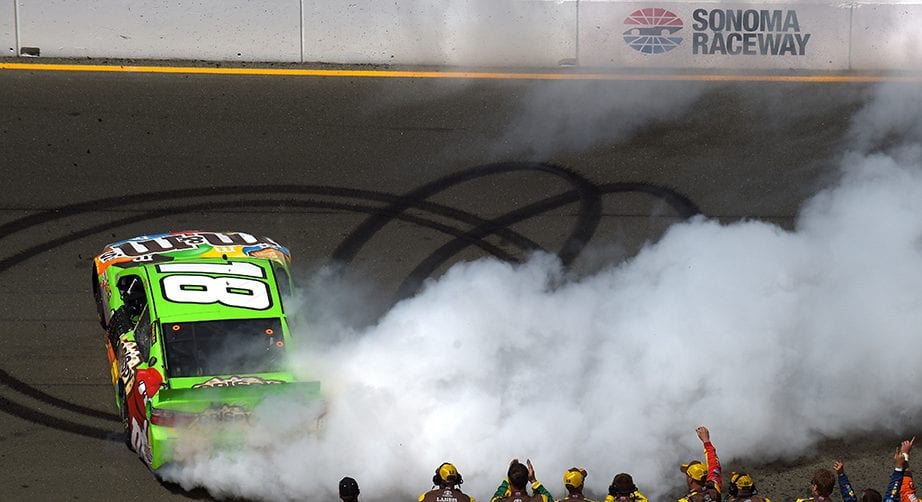 SONOMA, CA - JUNE 28: Kyle Busch, driver of the #18 M&M's Crispy Toyota, celebrates with a burnout after winning the NASCAR Sprint Cup Series Toyota/Save Mart 350 at Sonoma Raceway on June 28, 2015 in Sonoma, California. (Photo by Jonathan Moore/Getty Images) | Getty Images