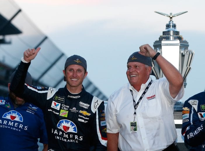 INDIANAPOLIS, IN - JULY 23:  Kasey Kahne, driver of the #5 Farmers Insurance Chevrolet, celebrates with team owner Rick Hendrick and his crew after winning the Monster Energy NASCAR Cup Series Brickyard 400 at Indianapolis Motorspeedway on July 23, 2017 in Indianapolis, Indiana.  (Photo by Brian Lawdermilk/Getty Images) | Getty Images