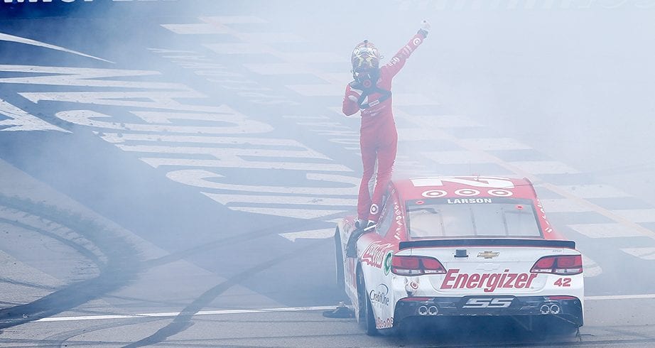 BROOKLYN, MI - AUGUST 13:  Kyle Larson, driver of the #42 Target Chevrolet, celebrates with a burnout after winning the Monster Energy NASCAR Cup Series Pure Michigan 400 at Michigan International Speedway on August 13, 2017 in Brooklyn, Michigan.  (Photo by Brian Lawdermilk/Getty Images) | Getty Images
