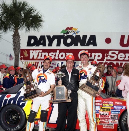 DAYTONA BEACH, FL - FEBRUARY 19:  Driver Darrell Waltrip celebrates in Victory lane with crew chief Jeff Hammond and car owner Rick Hendrick after winning the Daytona 500 race on February 19, 1989 at the Daytona International Speedway in Daytona Beach, Florida. (Photo by Dozier Mobley/Getty Images)