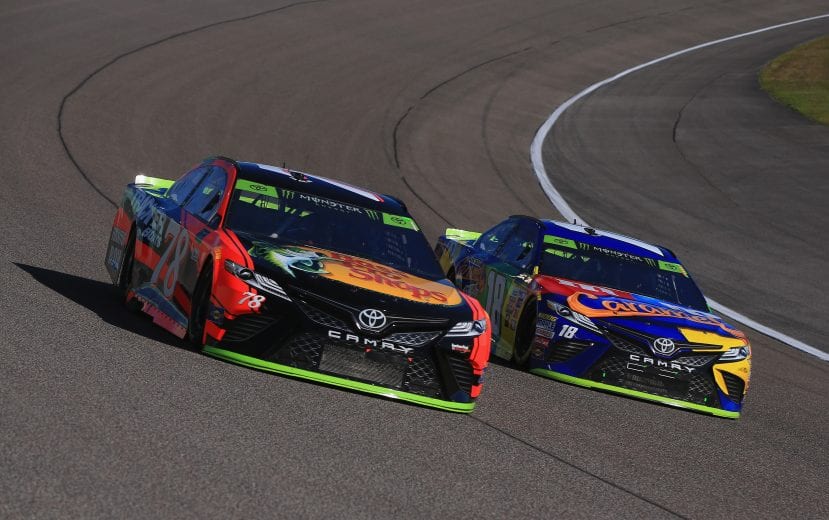 HOMESTEAD, FL - NOVEMBER 19: Martin Truex Jr., driver of the #78 Bass Pro Shops/Tracker Boats Toyota, and Kyle Busch, driver of the #18 M&M's Caramel Toyota, race during the Monster Energy NASCAR Cup Series Championship Ford EcoBoost 400 at Homestead-Miami Speedway on November 19, 2017 in Homestead, Florida. (Photo by Chris Trotman/Getty Images) | Getty Images