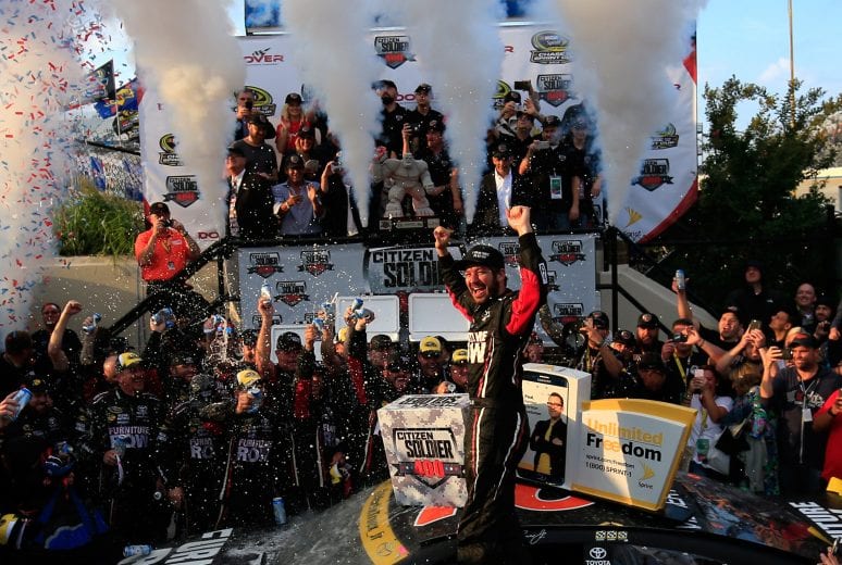 DOVER, DE - OCTOBER 02: Martin Truex Jr., driver of the #78 Furniture Row/Denver Mattress Toyota, celebrates in Victory Lane after winning the NASCAR Sprint Cup Series Citizen Solider 400 at Dover International Speedway on October 2, 2016 in Dover, Delaware. (Photo by Chris Trotman/Getty Images) | Getty Images