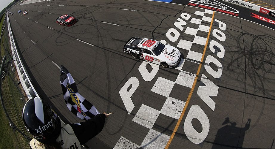 LONG POND, PENNSYLVANIA - JUNE 01: Cole Custer, driver of the #00 FIMS Manufacturing Ford, crosses the finish line to win the NASCAR Xfinity Series Pocono Green 250 at Pocono Raceway on June 01, 2019 in Long Pond, Pennsylvania. (Photo by Chris Trotman/Getty Images) | Getty Images