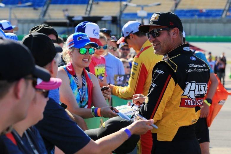 SPARTA, KENTUCKY - JULY 12: Clint Bowyer, driver of the #14 Rush Truck Centers/Haas Automation Ford, signs autographs during qualifying for the Monster Energy NASCAR Cup Series Quaker State 400 Presented by Walmart at Kentucky Speedway on July 12, 2019 in Sparta, Kentucky. (Photo by Daniel Shirey/Getty Images)