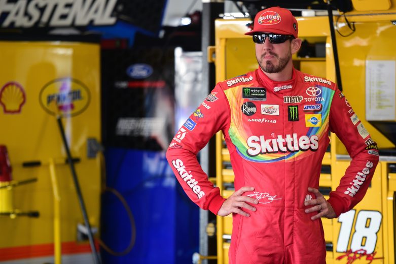 LONG POND, PENNSYLVANIA - JULY 27: Kyle Busch, driver of the #18 Skittles Toyota, stands in the garage area during practice for the Monster Energy NASCAR Cup Series Gander RV 400 at Pocono Raceway on July 27, 2019 in Long Pond, Pennsylvania. (Photo by Jared C. Tilton/Getty Images) | Getty Images