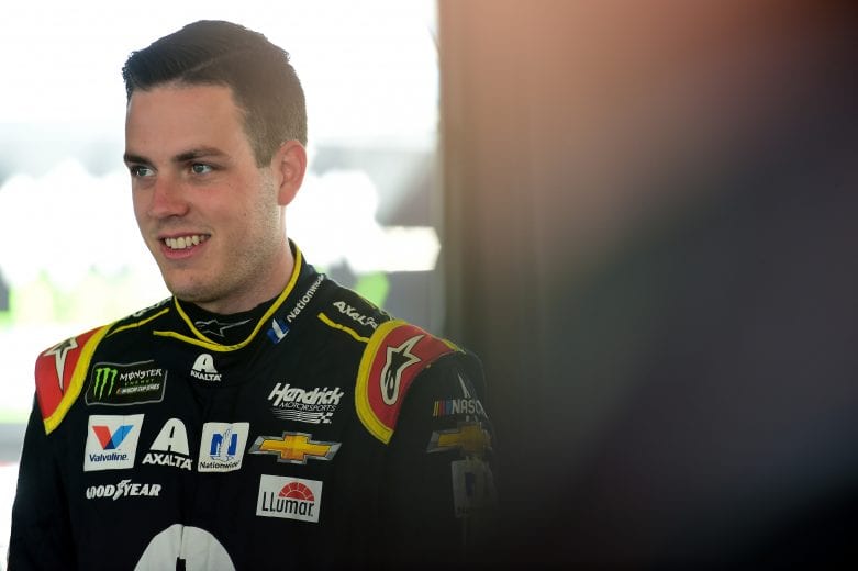 JOLIET, ILLINOIS - JUNE 29: Alex Bowman, driver of the #88 Axalta Chevrolet, stands in the garage area during practice for the Monster Energy NASCAR Cup Series Camping World 400 at Chicagoland Speedway on June 29, 2019 in Joliet, Illinois. (Photo by Jared C. Tilton/Getty Images) | Getty Images