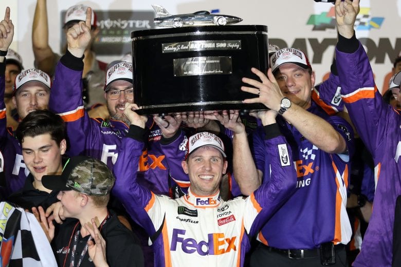 DAYTONA BEACH, FL - FEBRUARY 17: Denny Hamlin, driver of the #11 FedEx Express Toyota, celebrates in victory lane after winning the Monster Energy NASCAR Cup Series 61st Annual Daytona 500 at Daytona International Speedway on February 17, 2019 in Daytona Beach, Florida. (Photo by Chris Graythen/Getty Images) | Getty Images