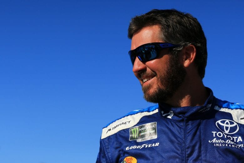 SPARTA, KENTUCKY - JULY 12: Martin Truex Jr., driver of the #19 Auto Owners Insurance Toyota, stands on the grid during qualifying for the Monster Energy NASCAR Cup Series Quaker State 400 Presented by Walmart at Kentucky Speedway on July 12, 2019 in Sparta, Kentucky. (Photo by Daniel Shirey/Getty Images)