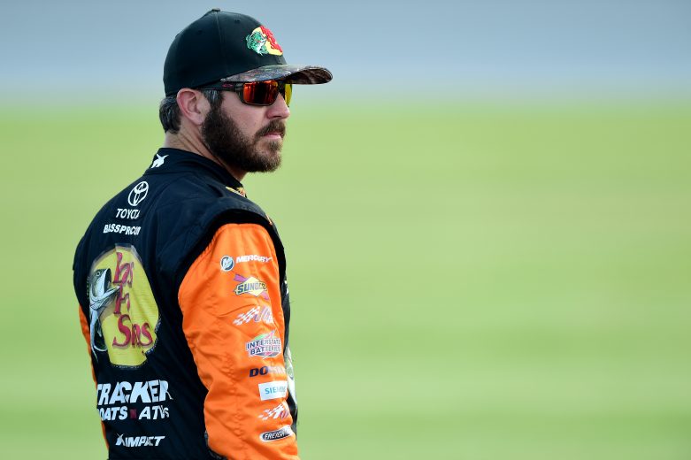 JOLIET, ILLINOIS - JUNE 29: Martin Truex Jr., driver of the #19 Bass Pro Shops Toyota, stands on the grid during qualifying for the Monster Energy NASCAR Cup Series Camping World 400 at Chicagoland Speedway on June 29, 2019 in Joliet, Illinois. (Photo by Jared C. Tilton/Getty Images) | Getty Images