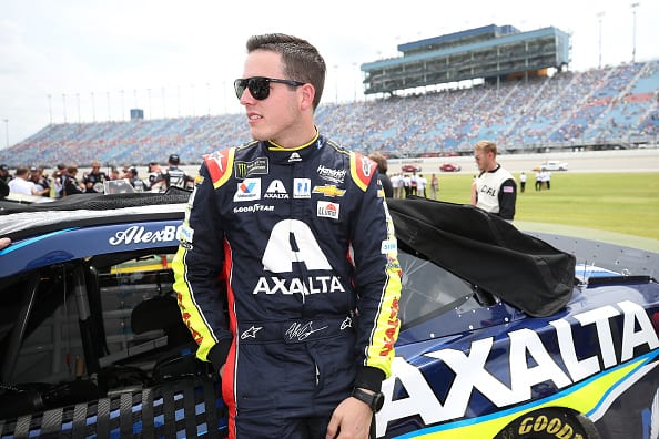 JOLIET, ILLINOIS - JUNE 30: Alex Bowman, driver of the #88 Axalta Chevrolet, stands by his car during the Monster Energy NASCAR Cup Series Camping World 400 at Chicagoland Speedway on June 30, 2019 in Joliet, Illinois. (Photo by Matt Sullivan/Getty Images) | Getty Images