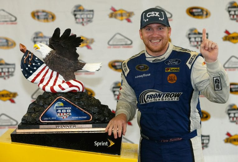 LONG POND, PA - AUGUST 01: Chris Buescher, driver of the #34 Dockside Logistics Ford, celebrates in victory lane after winning the NASCAR Sprint Cup Series Pennsylvania 400 at Pocono Raceway on August 1, 2016 in Long Pond, Pennsylvania. The race was delayed due to inclement weather on Sunday, July 31. (Photo by Brian Lawdermilk/Getty Images) | Getty Images