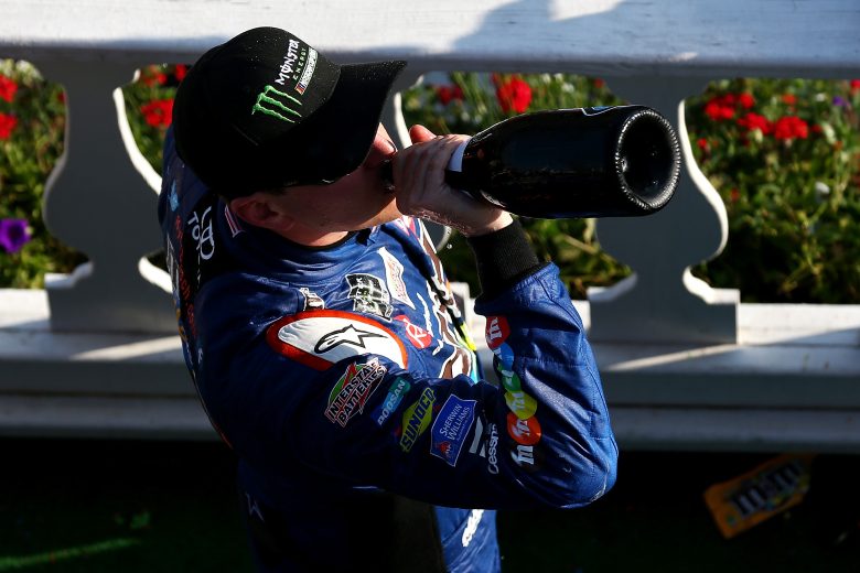 LONG POND, PA - JULY 29:  Kyle Busch, driver of the #18 M&M's Caramel Toyota, celebrates with champagne in Victory Lane after winning the Monster Energy NASCAR Cup Series Gander Outdoors 400 at Pocono Raceway on July 29, 2018 in Long Pond, Pennsylvania.  (Photo by Sarah Crabill/Getty Images) | Getty Images