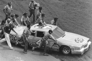 DAYTONA BEACH, FL - JULY 4, 1984: The Petty Enterprises crew pushes Richard PettyÕs car to victory lane following his 200th career NASCAR Cup win in the Firecracker 400 at Daytona International Speedway. (Photo by ISC Images & Archives via Getty Images)
